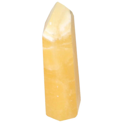 Mexican Calcite Obelisk from Sylvia Crystals, enhances self-confidence and motivation with vibrant energy flow.