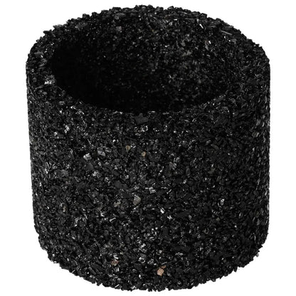 Black tourmaline candle holder with textured surface, offering spiritual harmony and decorative elegance.