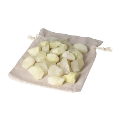 Tumbled Sulphur crystals on a beige cloth bag, showcasing vibrant yellow hues and premium quality for spiritual purification.