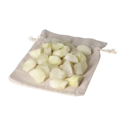 Tumbled Sulphur crystals on a beige cloth bag, showcasing vibrant yellow hues and premium quality for spiritual purification.