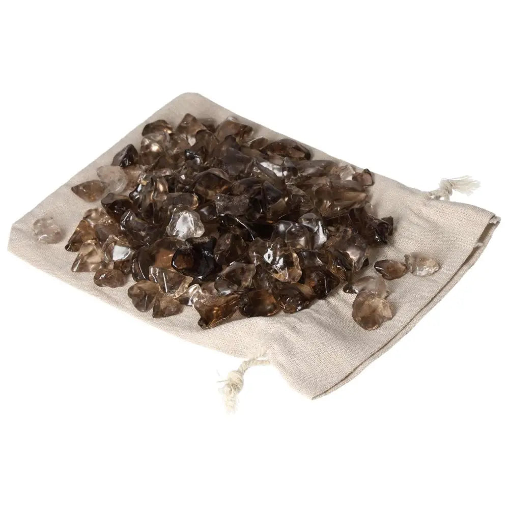 Tumbled Smoky Quartz crystals on a white pouch, offering grounding and clarity for business professionals. Perfect for decision-making support.
