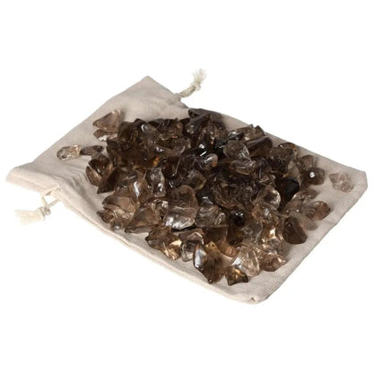 Tumbled Smoky Quartz crystals on a cloth bag, showcasing premium quality and grounding properties for enhanced practical thinking.