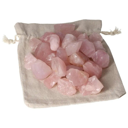 Tumbled Rose Quartz stones on fabric bag from Sylvia Crystals, symbolizing love and emotional healing.