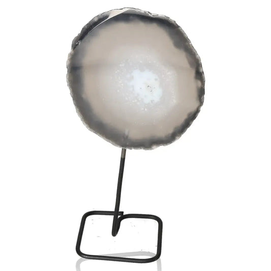 Elegant agate slice on a metal stand, promoting balance and tranquility in home decor, with a sleek and modern design.