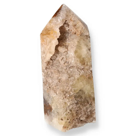 Natural Agate Geoded Point crystal displaying intricate earth-toned patterns, showcasing serene beauty and transformative properties.