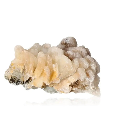 Cream calcite crystal stone showcasing energy amplification properties and unique formations for spiritual growth and healing.