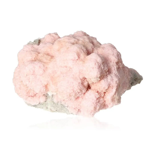 Rhodochrosite gemstone representing self-love and emotional healing, known for activating the Heart Chakra. Unique blush-pink mineral.
