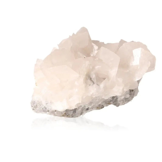 White calcite crystal from Sylvia Crystals, highlighting its energy-amplifying properties and spiritual alignment.