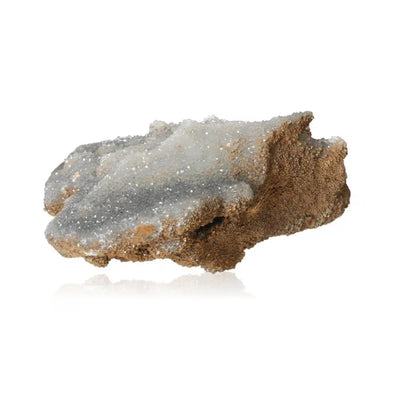 Natural quartz crystal with clear, glass-like surface and earthy base, ideal for energy amplification and spiritual growth.