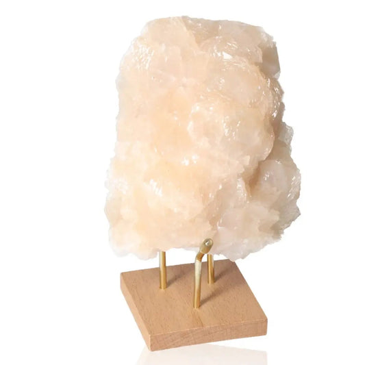 Honey Calcite stone on a wooden stand, promoting confidence and clarity; ideal for enhancing focus and motivation. Solar plexus aligned.