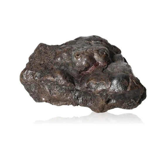 Natural Hematite stone, known for enhancing self-confidence and unleashing hidden energy, isolated on white background.