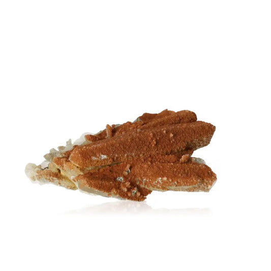 Quartz crystal with iron oxide for inspiration and energy, enhancing creativity and success in pursuits.