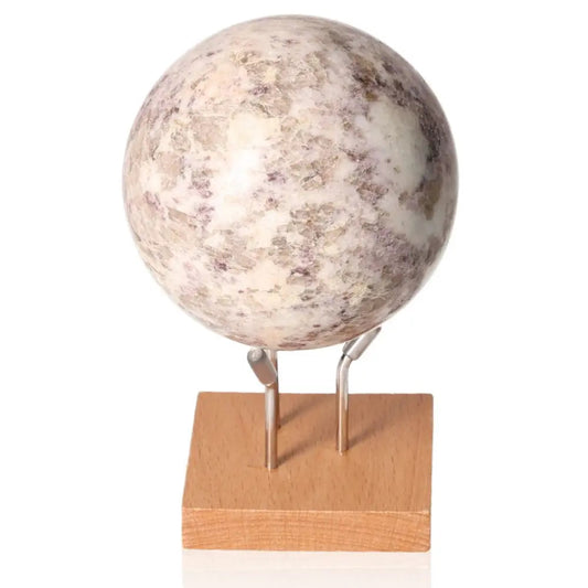 Lepidolite sphere on wooden stand promoting peace and emotional balance