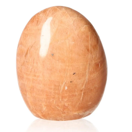 Peach Moonstone Free Form stone with a soothing peach hue, promotes calmness, emotional healing, and enhances intuition and feminine energy.
