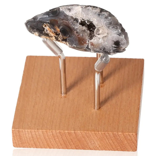 Mini Agate Geode on wooden stand showcasing crystal formations for tranquil spaces and balanced energy.