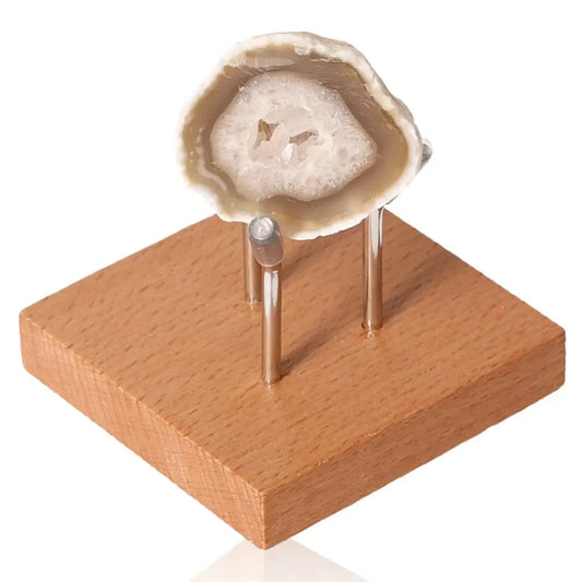 Mini Agate Geode on wooden stand, showcasing unique patterns and calming energy, perfect for decor and creating balance.