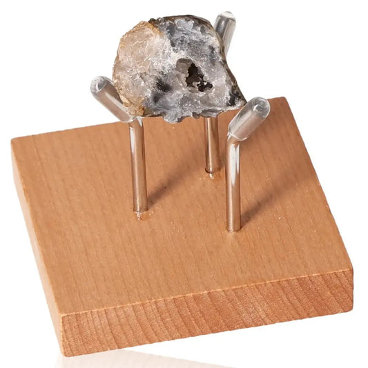 Mini Agate Geode on wooden stand, showcasing natural beauty and calming energy for home decor and personal wellness.