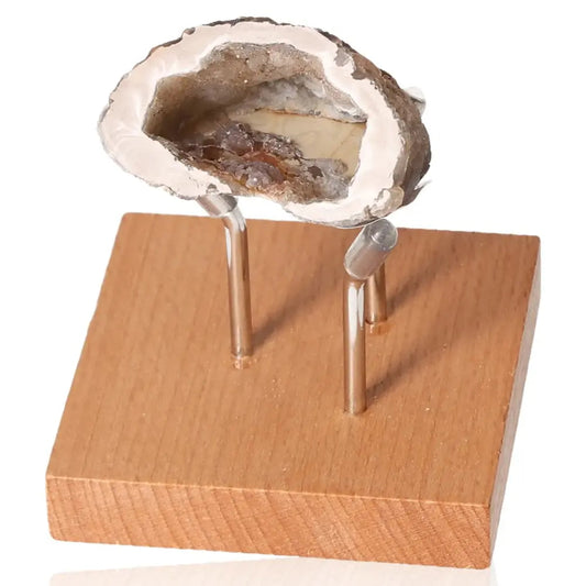 Mini Agate Geode on wooden stand, showcasing its natural beauty and tranquil design ideal for home or office decor.