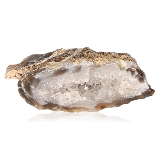 Mini Agate Geode showcasing its natural crystal interior, ideal for meditation and tranquility in home or office space.