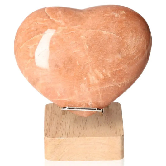 Heart-shaped peach moonstone promoting emotional balance and intuition, ideal for enhancing sensitivity and ensuring restful sleep.