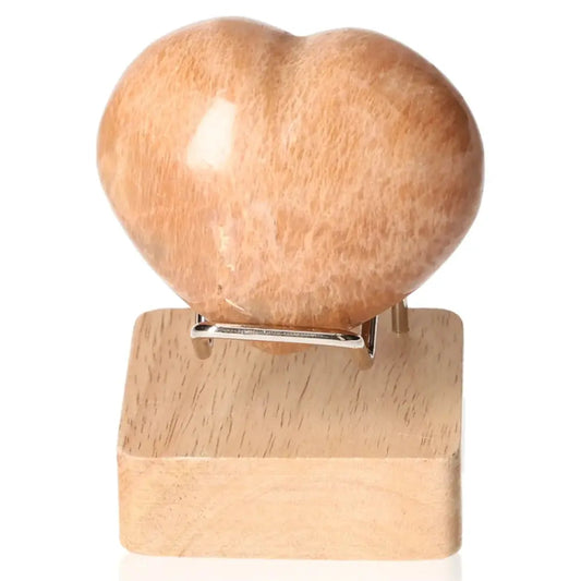 Peach Moonstone Heart on stand highlighting emotional balance and intuition, ideal for attraction and nightmare protection. Stand not included.