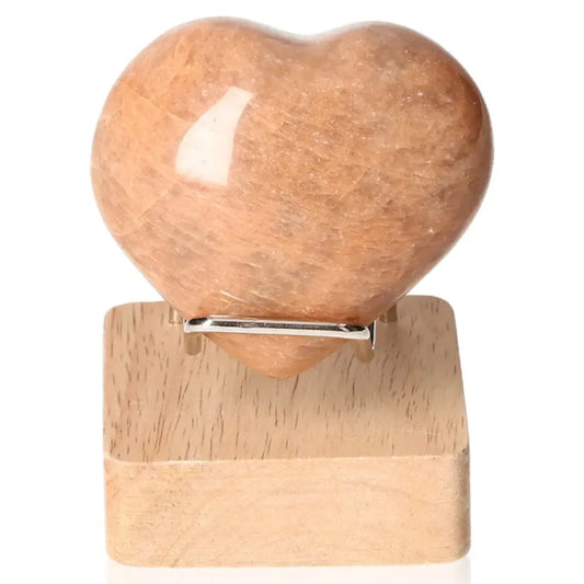 Peach Moonstone Heart gemstone on stand for emotional balance and intuition