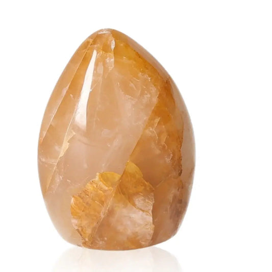 Honey Calcite free form gemstone showcasing warm golden hues, symbolizing confidence, clarity, and motivation. Aligns with solar plexus chakra.