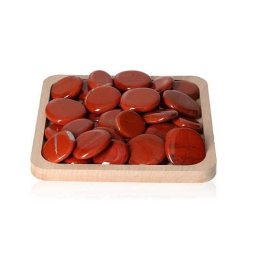 Wooden tray with smooth, polished Jasper Palm Stones for stress relief and harmony.