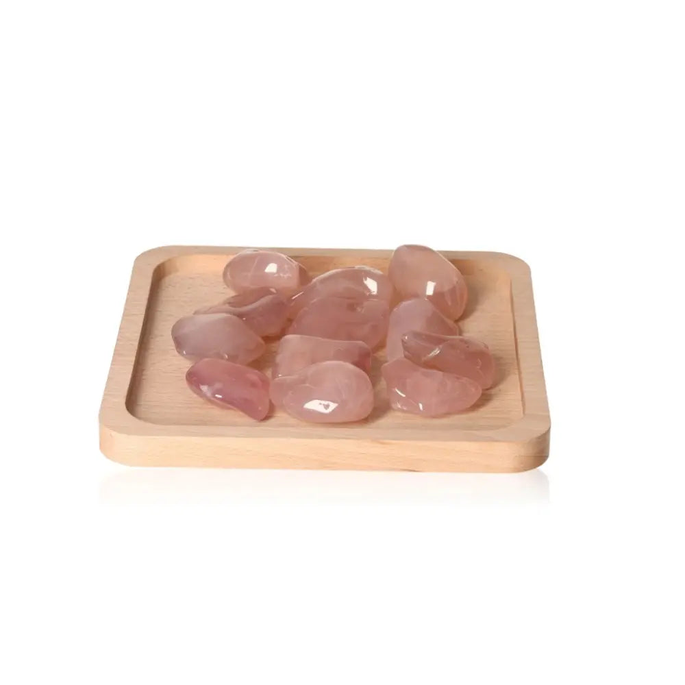 Pink Chalcedony XXL healing crystals on wooden tray, promoting emotional balance and protection from stress and anxiety.