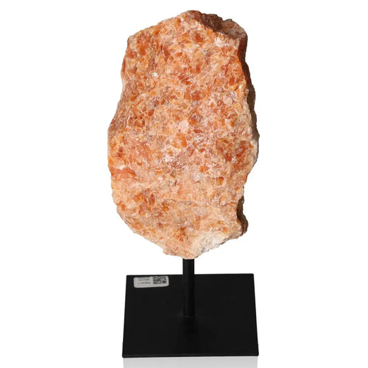 Orchid Calcite stone on metal stand, showcasing vibrant orange and pink hues for motivation and creativity.
