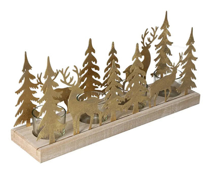 Gold winter forest design tealight holder with wooden base, featuring metal trees and deer silhouettes by Sylvia Crystals.