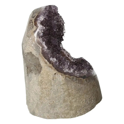 Amethyst cut base geode from Sylvia Crystals, showcasing natural purple hues and raw beauty, perfect for stress relief and energy renewal.