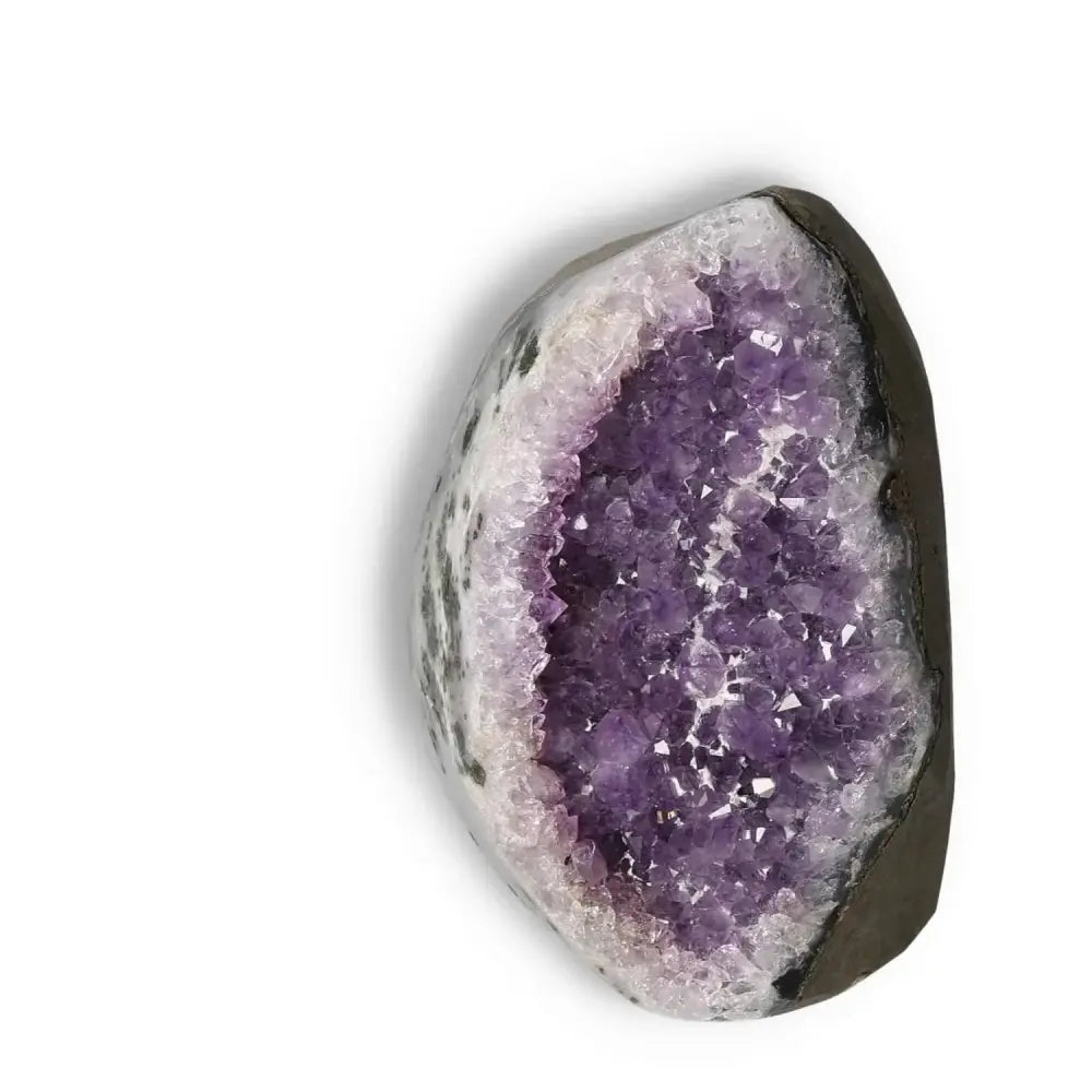 Amethyst Cut Base Geode crystal with vibrant purple hues, symbolizing luxury and stress relief from Sylvia Crystals.