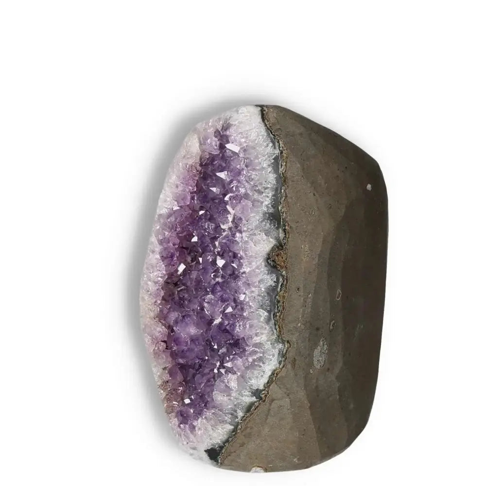 Amethyst Cut Base Geode from Sylvia Crystals, showcasing luxurious purple crystals for stress reduction and energy boost.