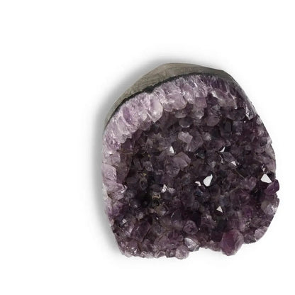 Premium Amethyst Cut Base Geode displaying its luxurious violet crystals; ideal for enhancing living spaces with elegance and spirituality.