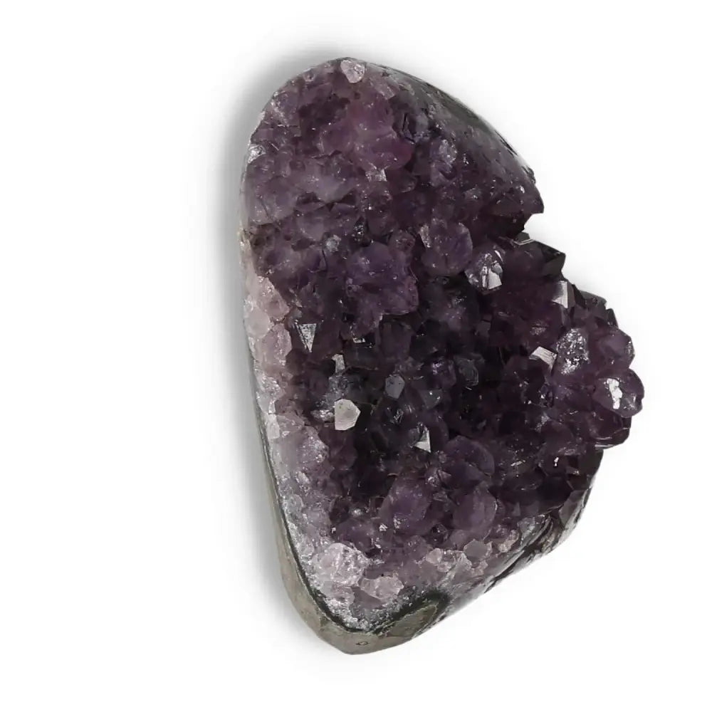Amethyst Cut Base Geode by Sylvia Crystals, showcasing deep purple hues and crystal formations for stress relief and emotional stability.