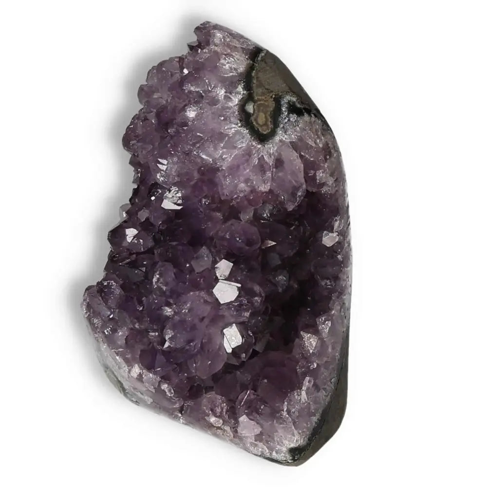 Amethyst Cut Base Geode by Sylvia Crystals showcasing radiant purple crystals for stress reduction and emotional balance.