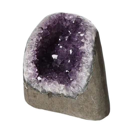 Amethyst Cut Base Geode from Sylvia Crystals with deep purple hues and unique formation, symbolizing peace and spiritual harmony.