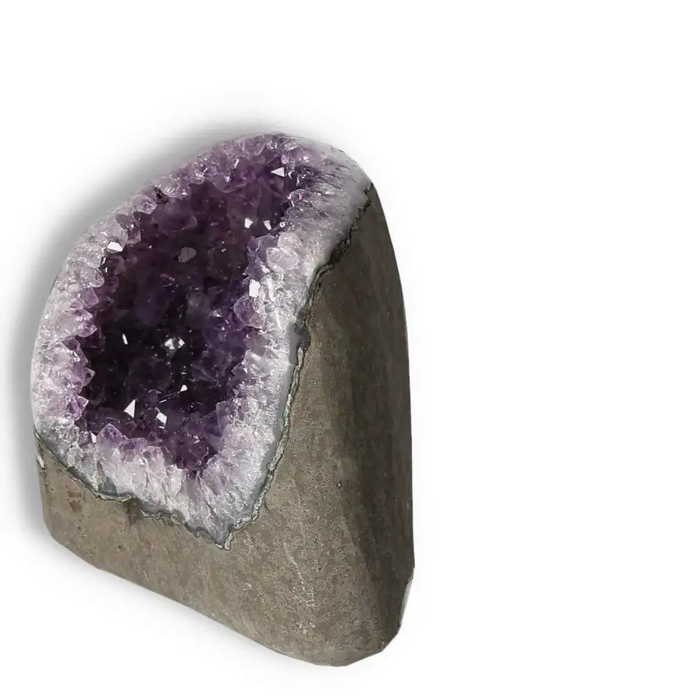 Amethyst Cut Base Geode featuring deep purple hues, known for spiritual properties and authenticity, handcrafted by Sylvia Crystals.