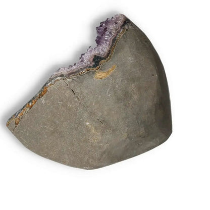 Amethyst cut base geode with violet crystals, offering stress relief and decoration, featured by Sylvia Crystals.