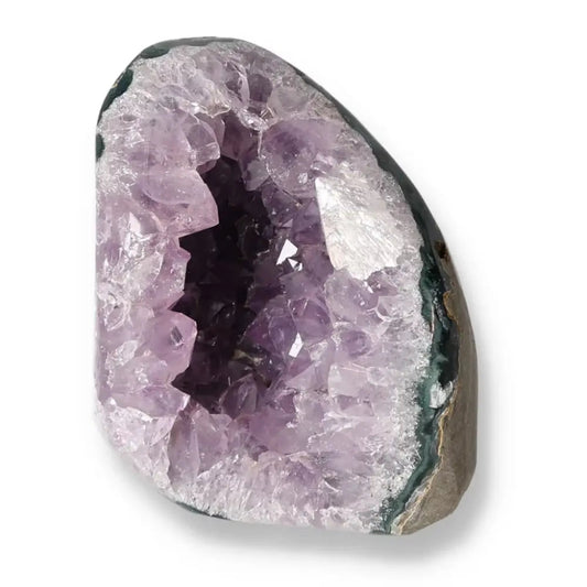 Amethyst cut base geode from Sylvia Crystals, showcasing deep purple crystals, luxury, and natural beauty in a spiritual statement piece.