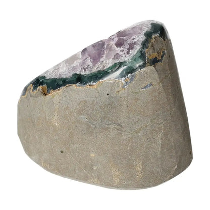Amethyst cut base geode from Sylvia Crystals, showcasing deep purple hues and natural crystalline structure. Perfect for luxury and spirituality.