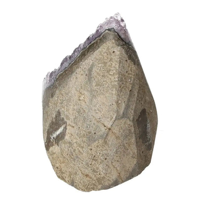 Amethyst cut base geode by Sylvia Crystals, showcasing luxurious natural artwork and stress-alleviating properties for enhanced focus.