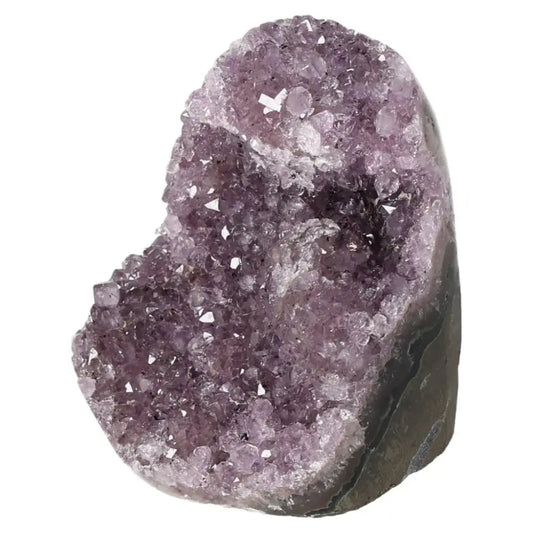 Amethyst cut base geode from Sylvia Crystals, featuring deep purple hues and sparkling crystals, enhancing well-being and reducing stress.