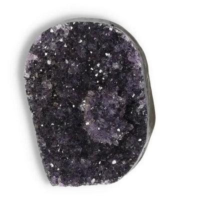 Amethyst cut base geode from Sylvia Crystals showcasing sparkling purple crystals, ideal for enhancing spiritual or living spaces.