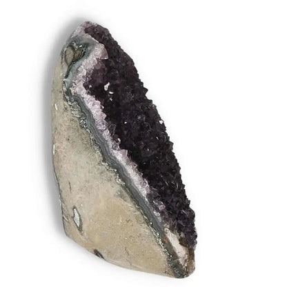 Amethyst cut base geode with purple crystals from Sylvia Crystals, known for stress reduction and promoting balance.