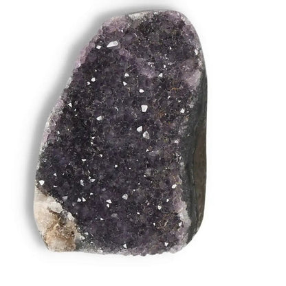 Amethyst cut base geode from Sylvia Crystals, enhancing tranquility and emotional stability, with stunning purple crystal formations.
