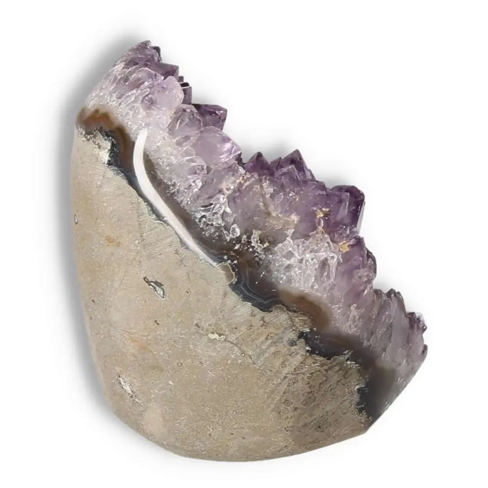 Amethyst cut base geode by Sylvia Crystals, showcasing luxury and natural beauty with exquisite purple crystals.