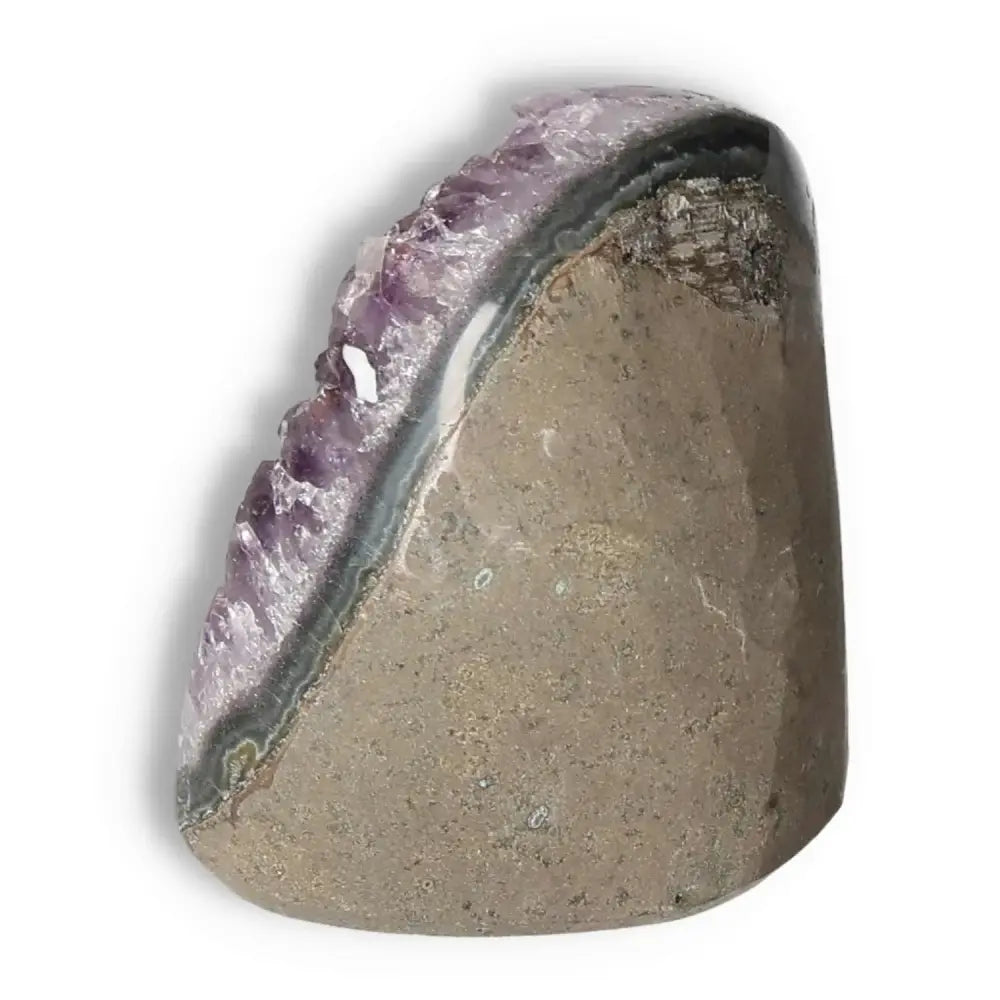 Amethyst cut base geode with deep purple hues from Sylvia Crystals, offering tranquility and natural splendor.