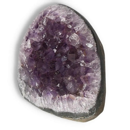 Amethyst cut base geode with deep purple hues, handpicked by Sylvia Crystals, offering natural beauty and tranquility.